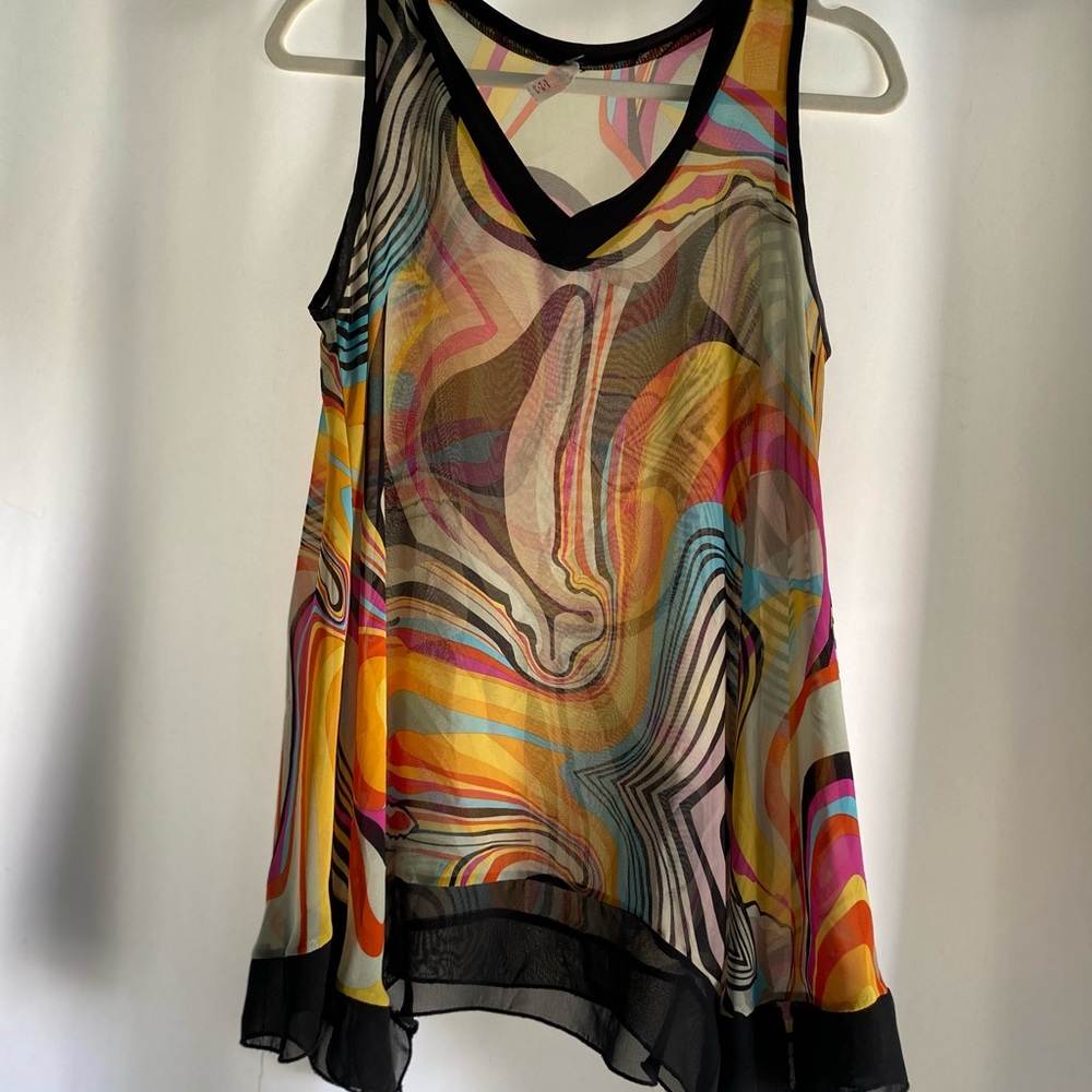Bright colors swirling around a light transparent fabric
